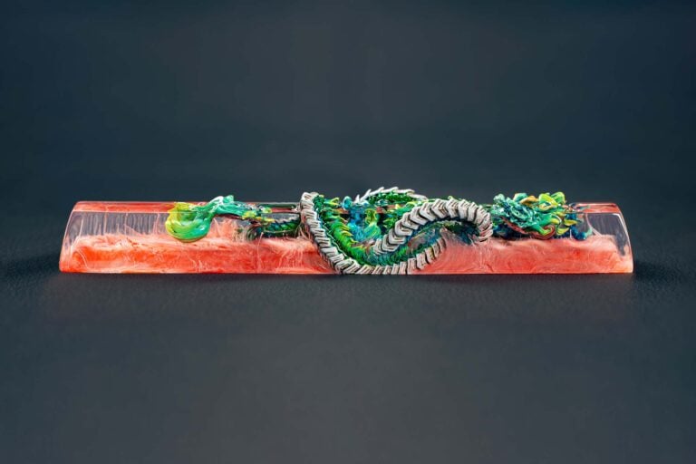 Colorful dragon sculpture encased in clear resin block.