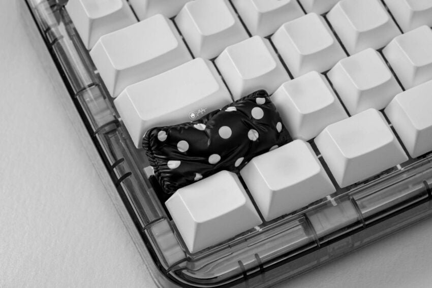 pillow artisan keycaps resting on mechanical keyboard.