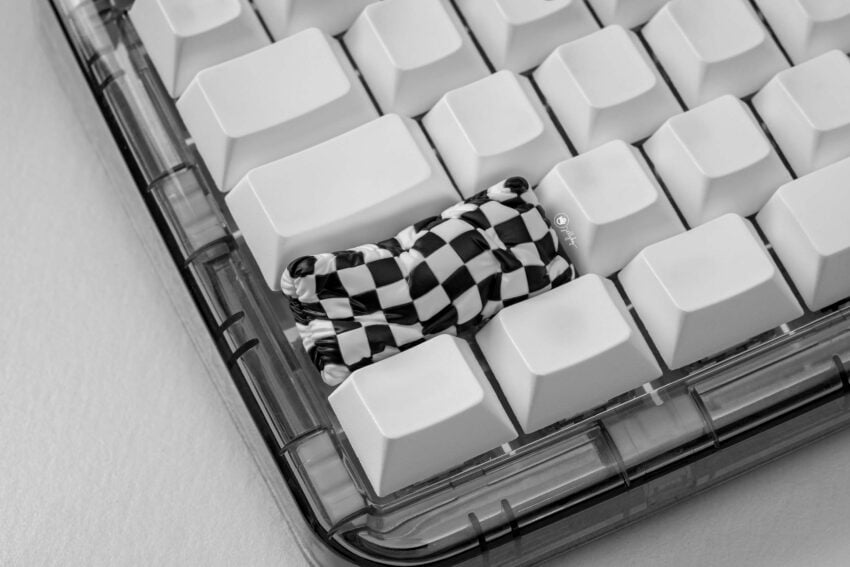 pillow artisan keycaps on mechanical keyboard keys.