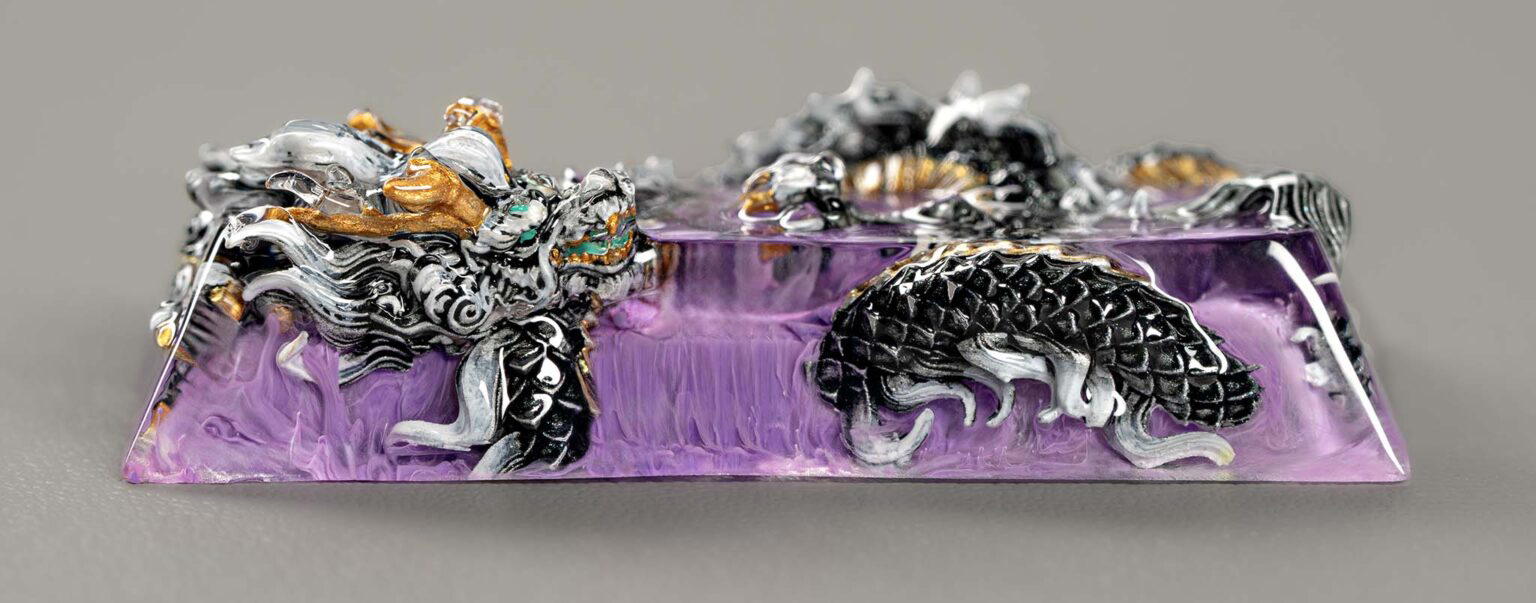 Intricate silver dragon sculpture on purple amethyst base.