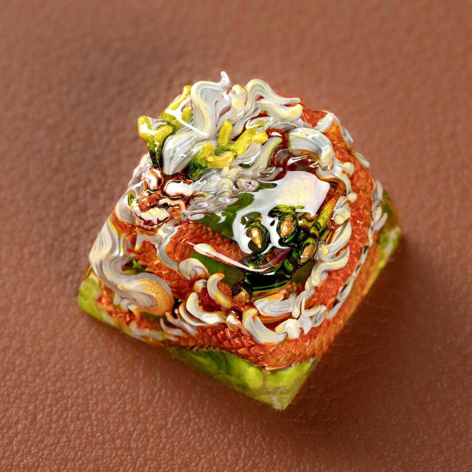 Colorful dragon sculpture on square pedestal.