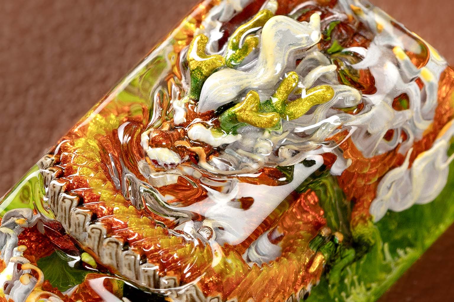 Close-up of colorful, textured glass art piece.