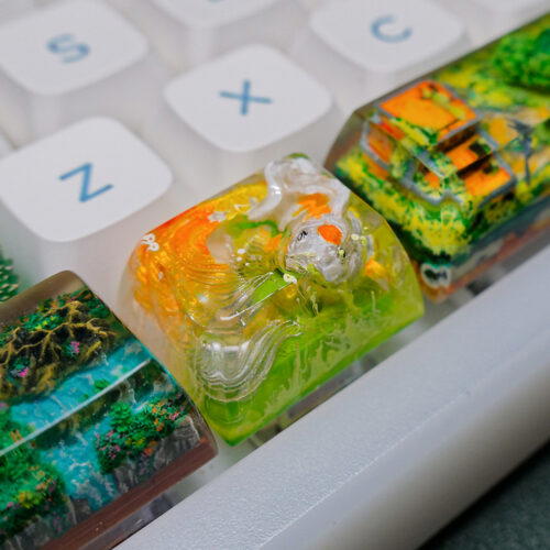 Colorful artisan keycaps on mechanical keyboard.